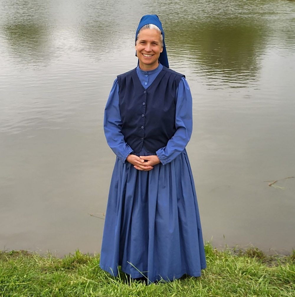 Heather standing beside a pond